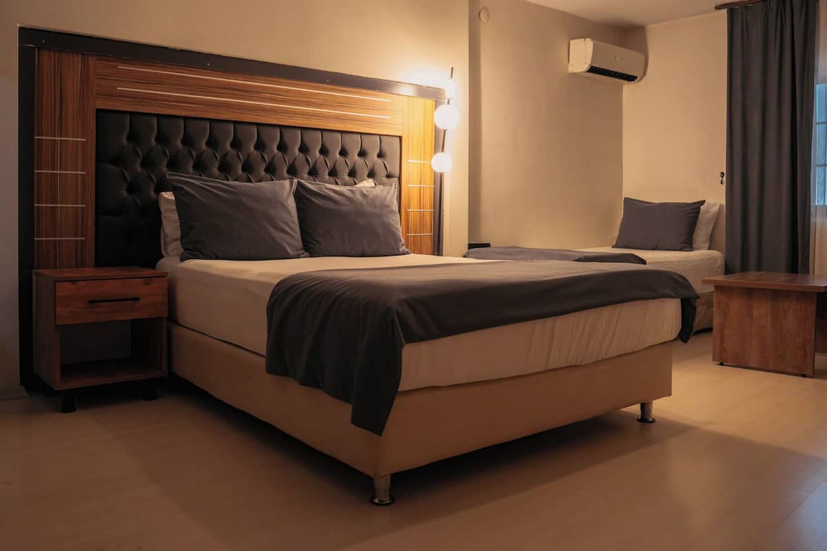 Family Quadruple Room | Minibar, desk, laptop workspace, blackout drapes