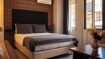 Deluxe Double Room | Minibar, desk, laptop workspace, blackout drapes