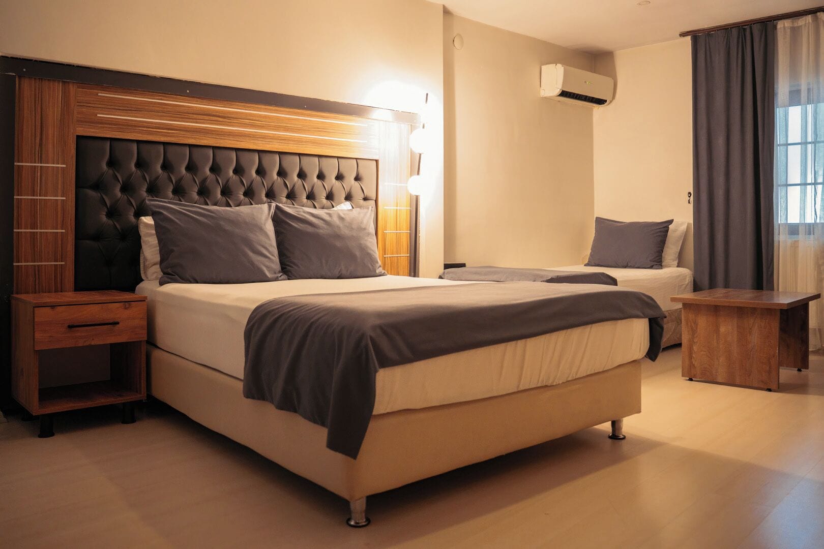 Family Quadruple Room | Minibar, desk, laptop workspace, blackout drapes