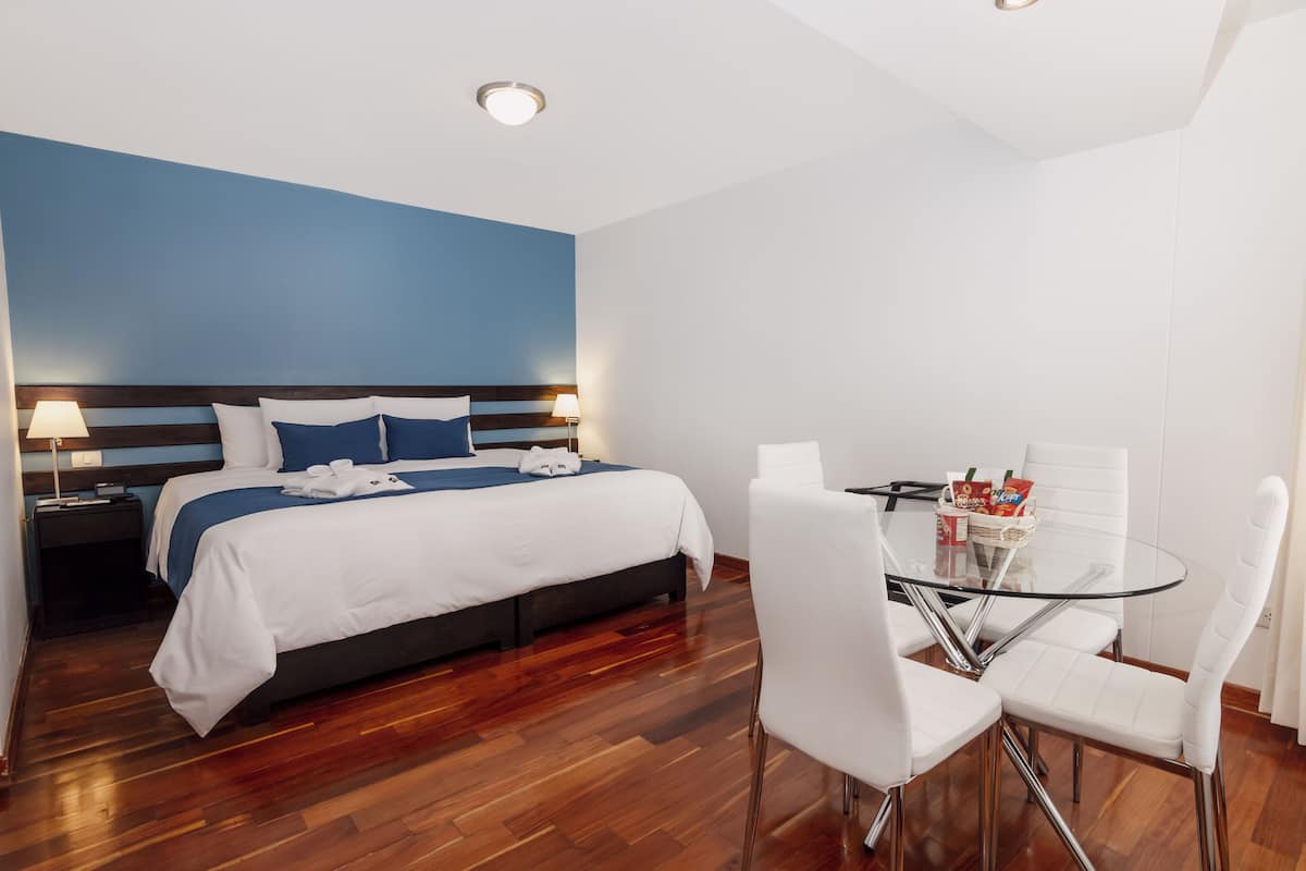 Deluxe Suite, City View | Premium bedding, down comforters, minibar, in-room safe