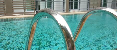 Outdoor pool, open 8:00 AM to 10:00 PM, sun loungers, lifeguards on site