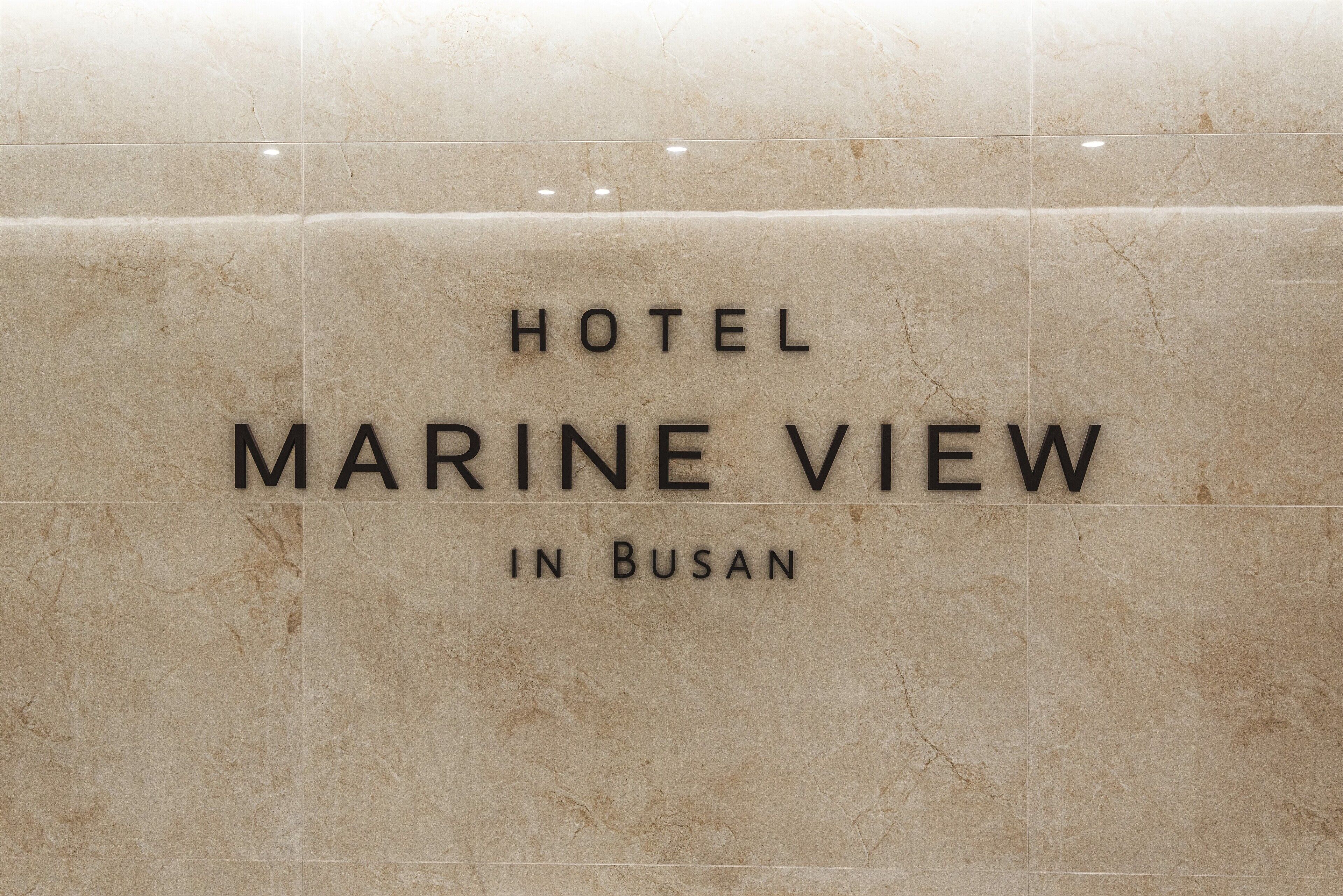 A sign for the Hotel Marine View in Busan.