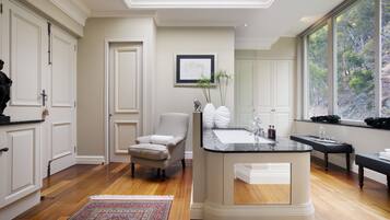 Enjoy a relaxing soak in the bathtub with a view of the outdoors.