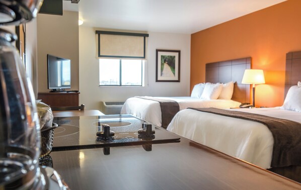 Premium bedding, pillow-top beds, desk, laptop workspace