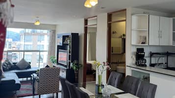 Comfort Apartment, 3 Bedrooms | Living room | 40-inch flat-screen TV with cable channels, TV, DVD player