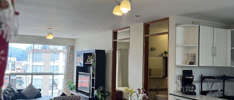 Comfort Apartment, 3 Bedrooms | Living room | 40-inch flat-screen TV with cable channels, TV, DVD player