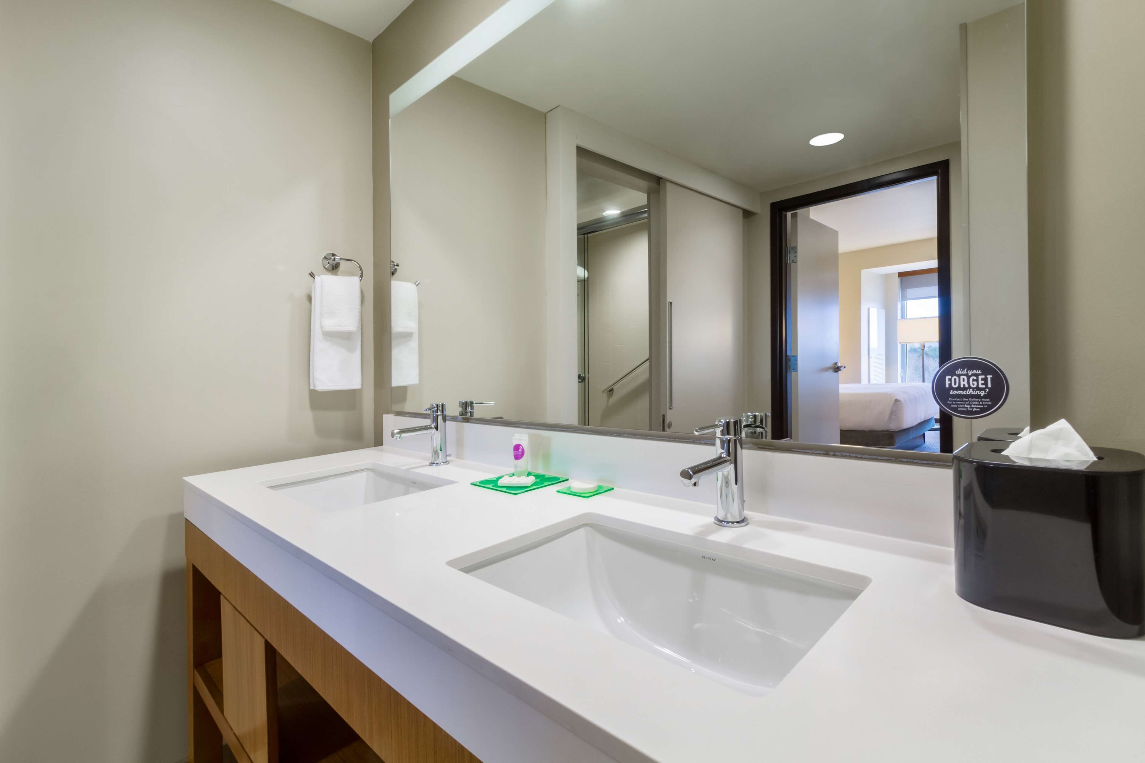 designer toiletries, hair dryer, towels