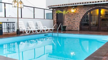 Seasonal outdoor pool, pool umbrellas, pool loungers