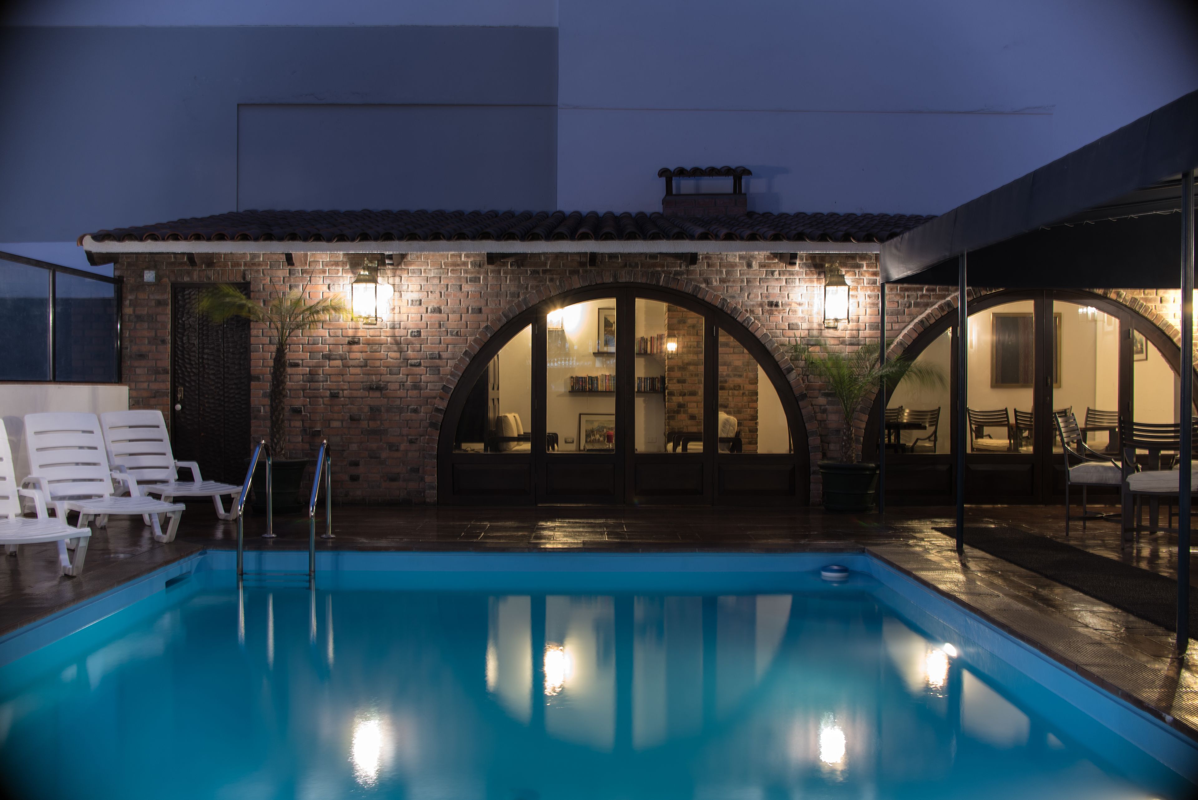 Seasonal outdoor pool, pool umbrellas, pool loungers