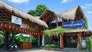 A hotel with thatched roofs, a sign reading 'FORTUNE HOTEL 2,' and a 'LUCKY STAY' banner. - FORTUNE HOTEL 2 LUCKY STAY Phu Quoc (Phu Quoc)