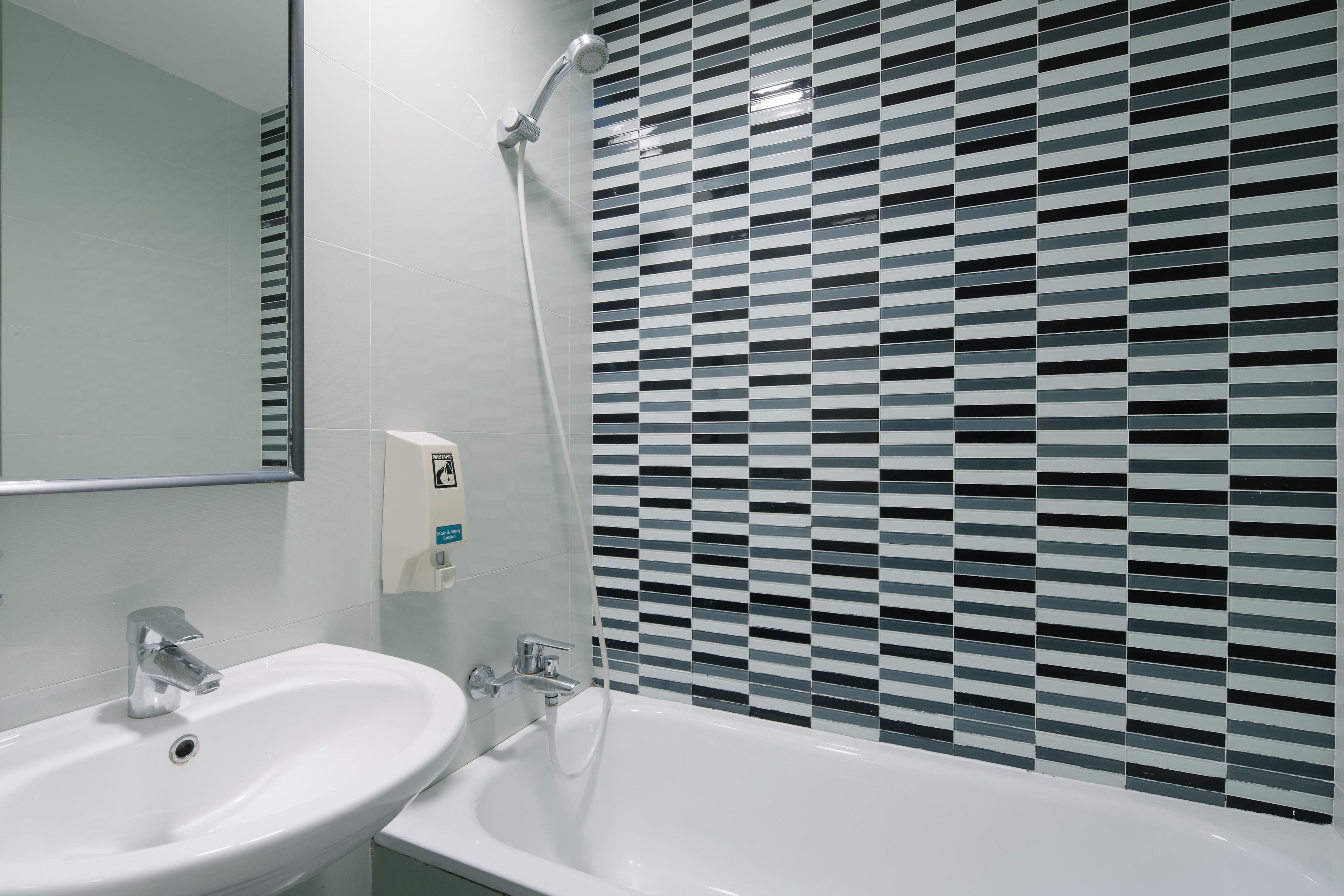 deep-soaking bathtub, hair dryer, towels