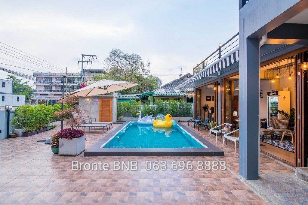 Outdoor pool, open 7 AM to midnight, pool umbrellas, sun loungers