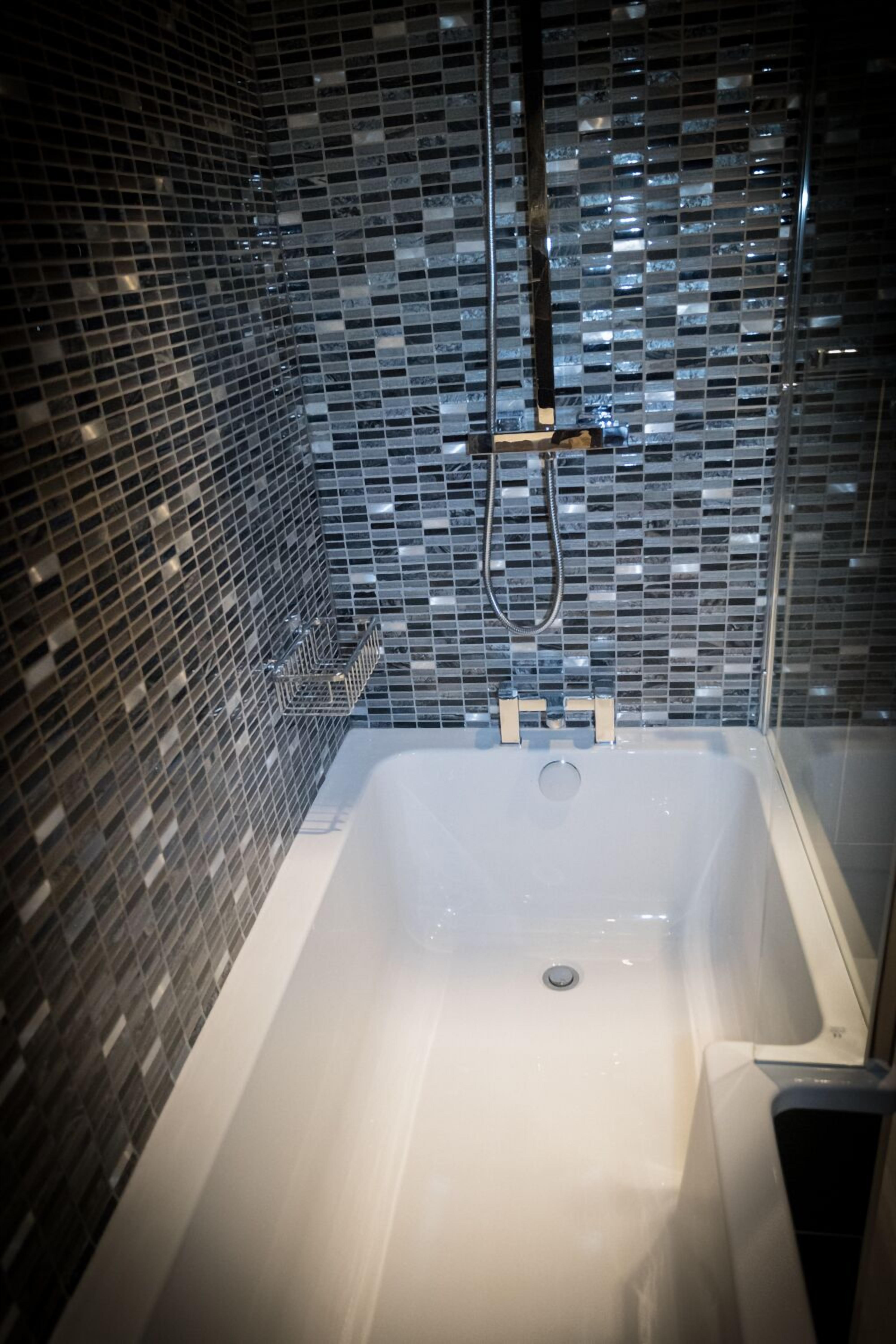 combined shower/bathtub, free toiletries, hair dryer, bathrobes