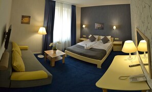 Superior Triple Room | Minibar, in-room safe, desk, iron/ironing board