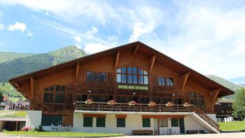 Experience the charm of Hotel Roc Et Neige, nestled in a picturesque mountain setting, with a balcony offering breathtaking views.