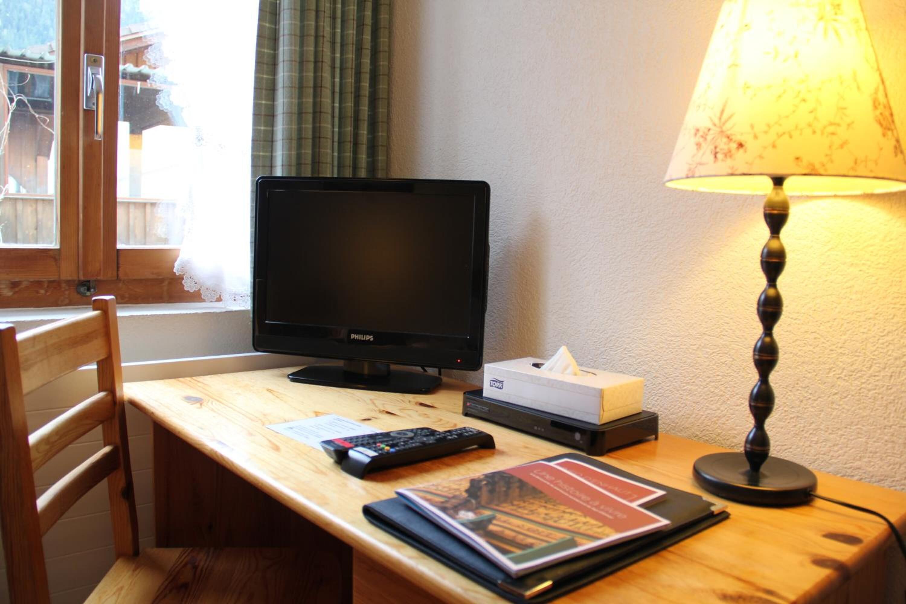 desk, blackout curtains, free cots/infant beds, rollaway beds