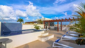 A rooftop pool area with lounge chairs, a small hot tub, and a pergola. - PDC003 2 Bedroom Apartment By Senstay (Playa del Carmen)