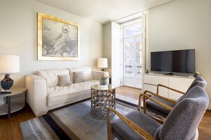 Deluxe Apartment, 1 Bedroom | Living area | Flat-screen TV, heated floors