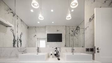 Apartamento, 1 quarto | Banheiro | Produtos de toalete grátis, secador de cabelo, chinelos, bidê