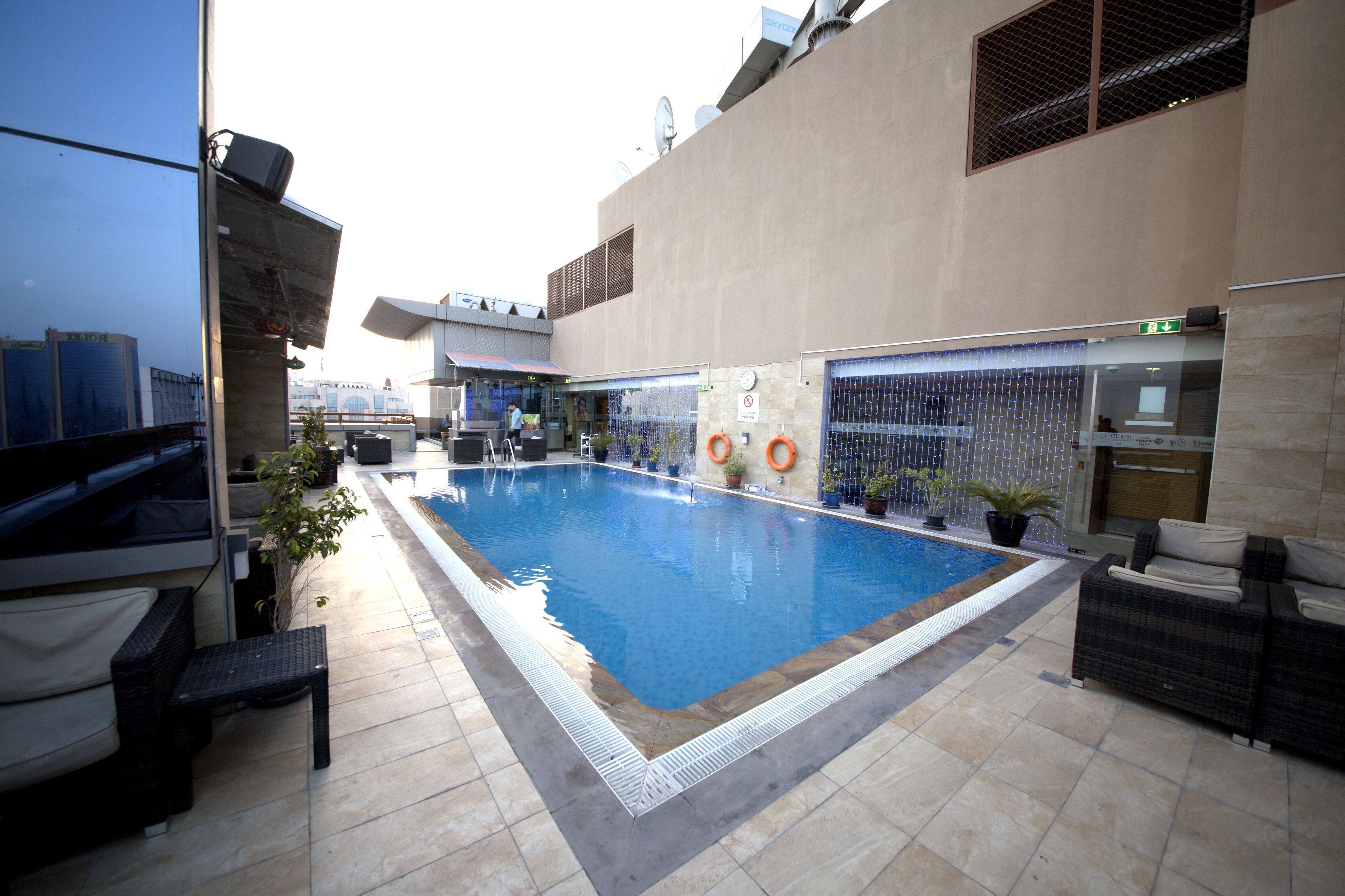 Outdoor pool, open 7:00 AM to 6:30 PM, pool umbrellas, pool loungers