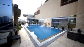 Outdoor pool, open 7:00 AM to 6:30 PM, pool umbrellas, pool loungers