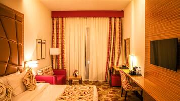 Egyptian cotton sheets, premium bedding, down duvets, minibar
