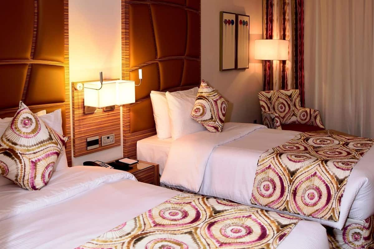 Egyptian cotton sheets, premium bedding, down duvets, minibar