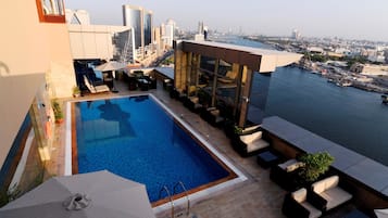 Outdoor pool, open 7:00 AM to 6:30 PM, pool umbrellas, sun loungers