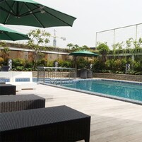 2 outdoor pools, open 6 AM to 10 PM, pool umbrellas