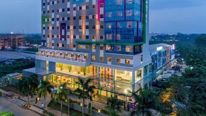 A multi-story hotel with a modern design, featuring a prominent 'HOTEL' sign on the top. - Ibis Styles Cikarang (Cikarang)
