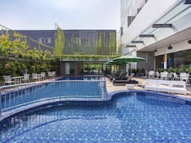 2 outdoor pools, open 6 AM to 10 PM, pool umbrellas