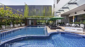 2 outdoor pools, open 6 AM to 10 PM, pool umbrellas