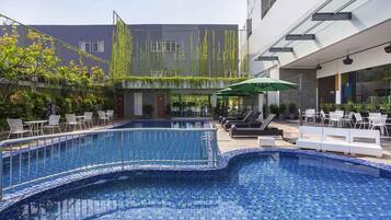 2 outdoor pools, open 6 AM to 10 PM, pool umbrellas