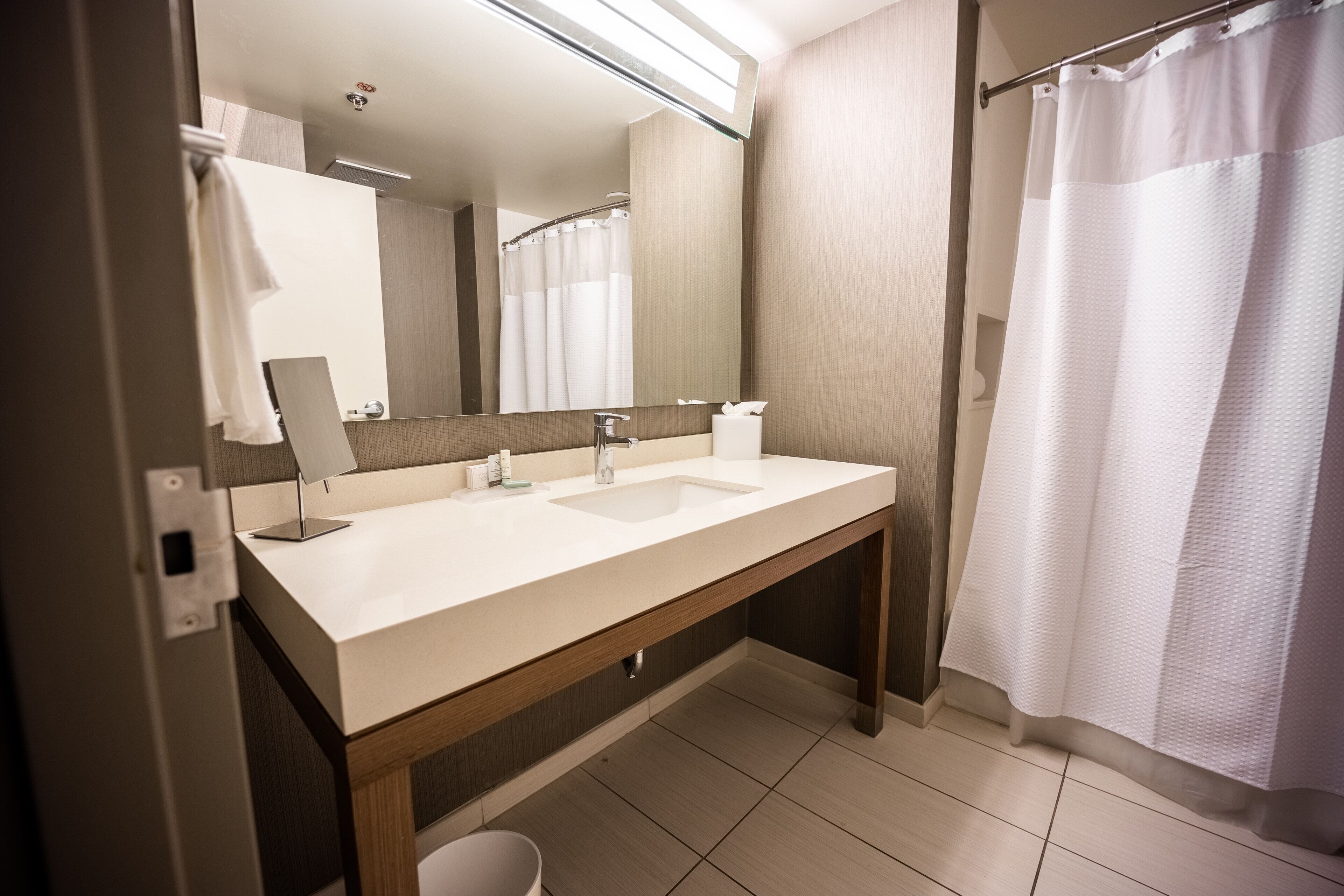 room, 1 king bed with sofa bed (mobility/hearing accessible, tub) | bathroom | hair dryer, towels, soap, shampoo