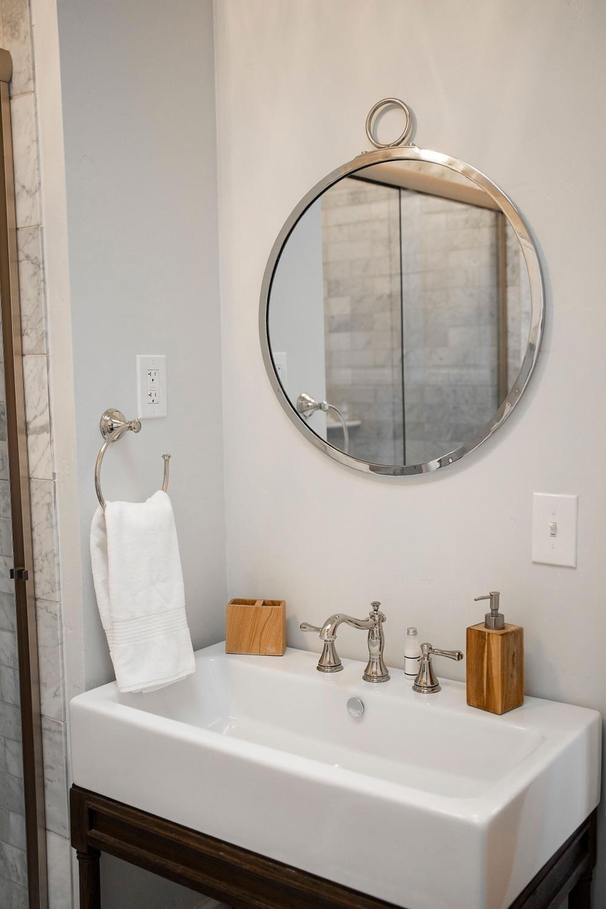 designer toiletries, hair dryer, towels