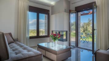 Villa, 3 Bedrooms, Private Pool (Anthelia) | Living area | 43-inch flat-screen TV with satellite channels, plasma TV, fireplace
