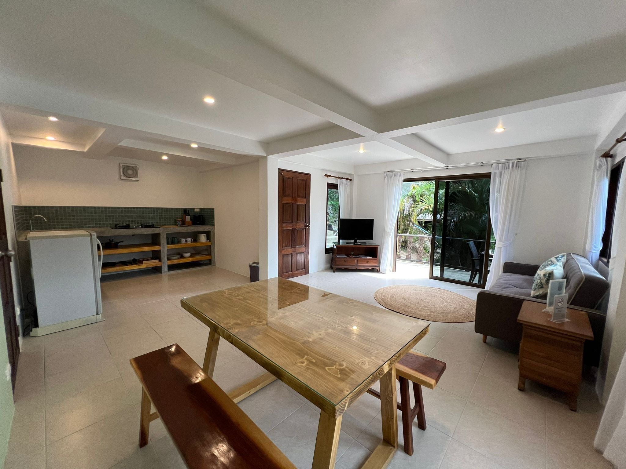 family apartment with garden view | living area | 32-inch led tv with digital channels