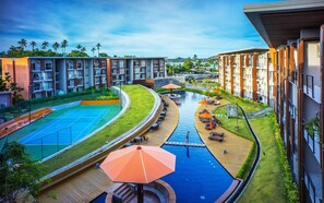 A modern hotel with a swimming pool, tennis court, and outdoor seating areas. - Pause on Samui (Koh Samui)