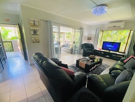 Deluxe House, 3 Bedrooms, Garden View, Poolside | Living area | 64-inch Smart TV with satellite channels, DVD player