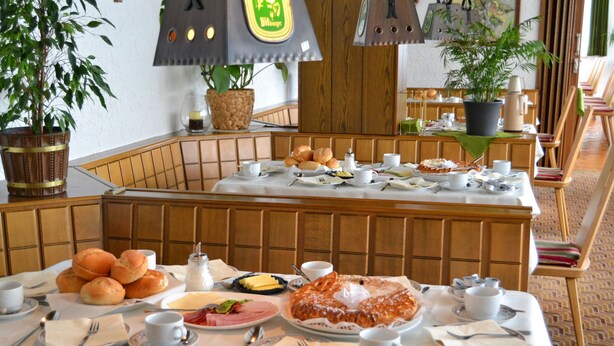 A breakfast buffet with various food items and a coffee machine. - Hotel Eifelhof Weina (Heimbach)