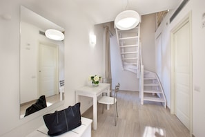 Standard Duplex, Sea View (Camera Mughetto) | Living area | Flat-screen TV