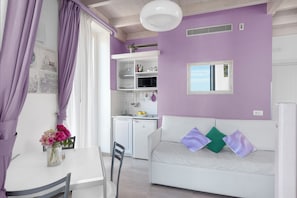 Deluxe Duplex, Sea View (Lavanda) | Living area | Flat-screen TV