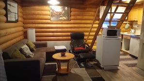 Big cottage,57sqm, 4 beds, 2-3 bedrooms | Living area | Flat-screen TV, fireplace - Vuokatticottage (Sotkamo)