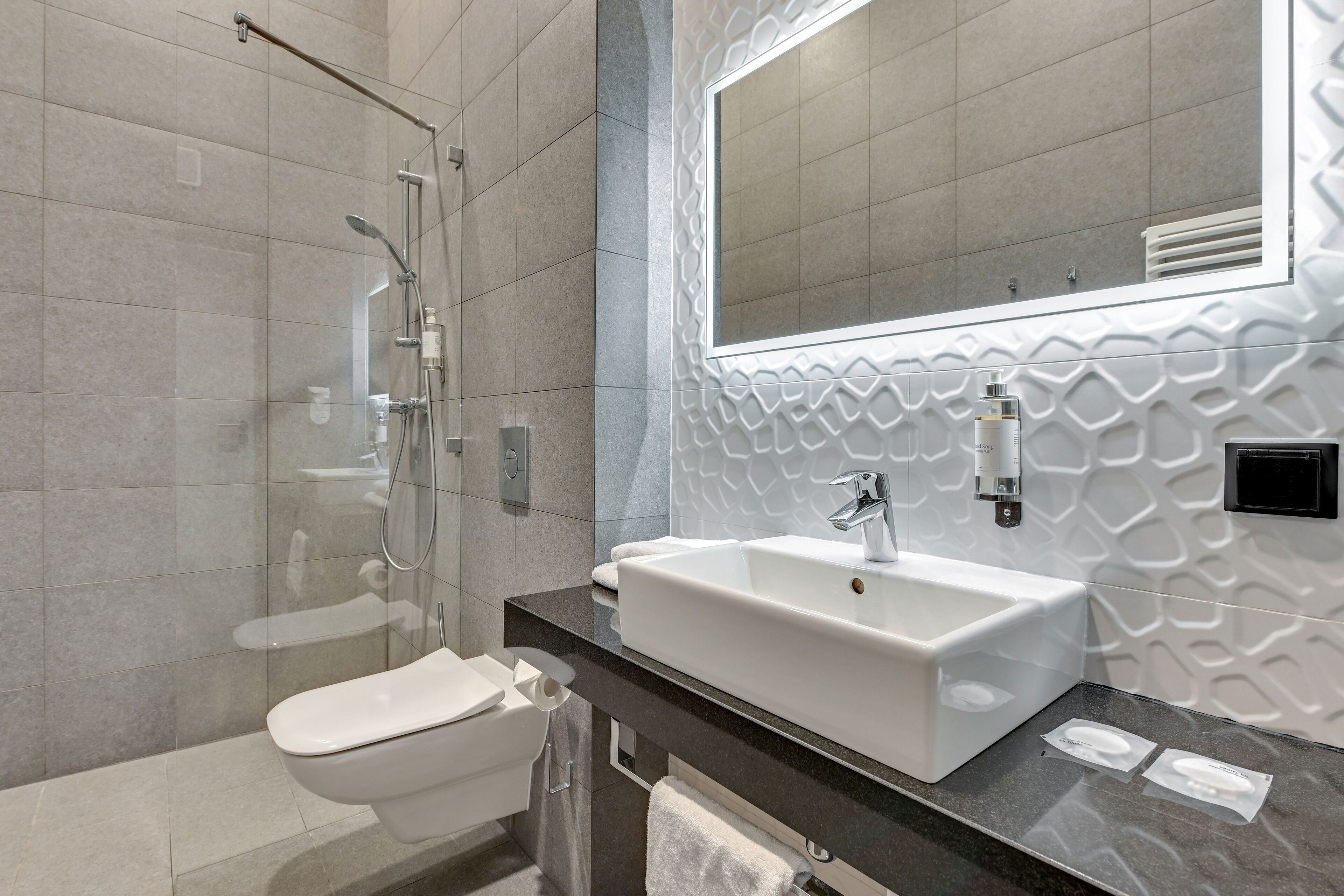superior double room | bathroom | shower, hair dryer, towels