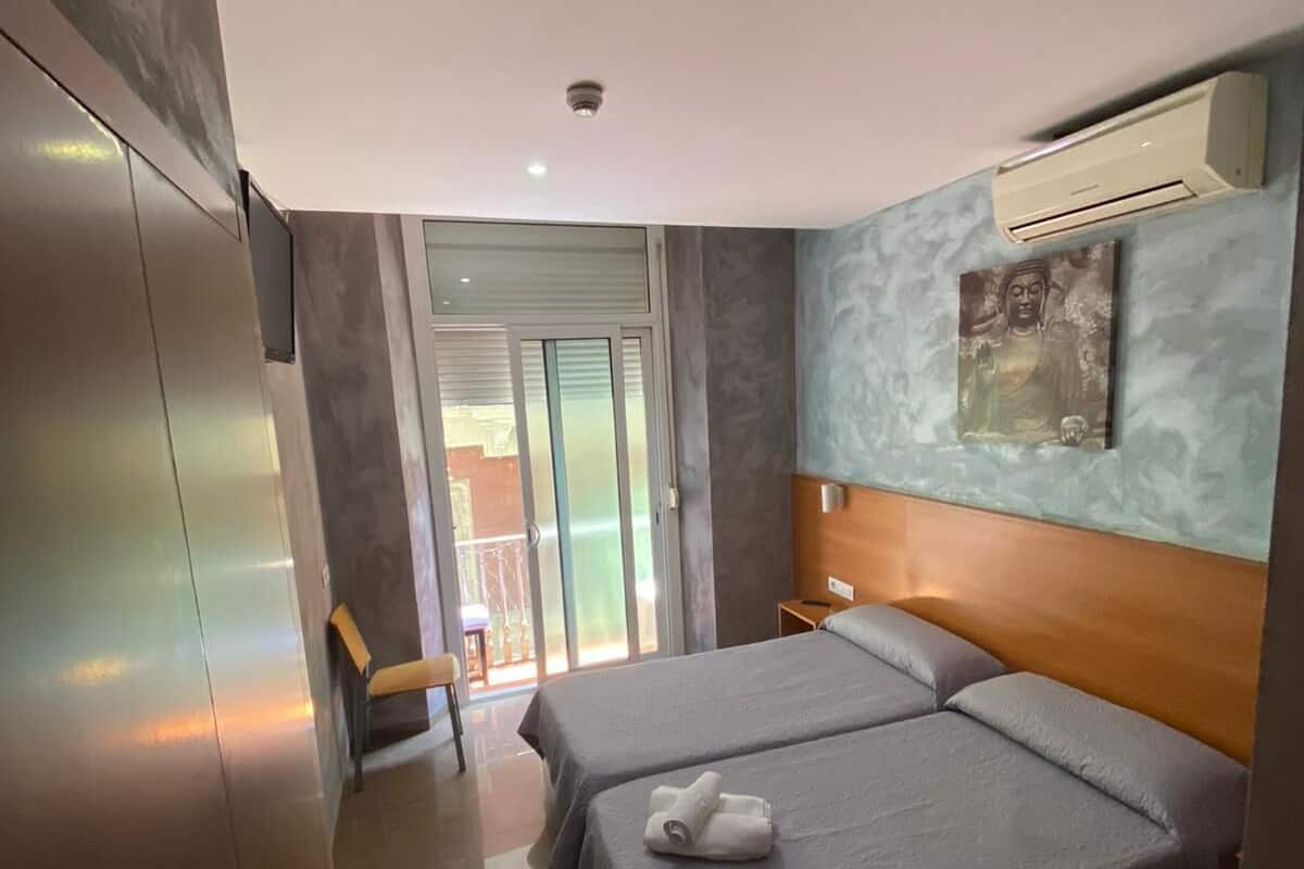 Twin kamer | Een kluis op de kamer, verduisterende gordijnen, gratis wifi, beddengoed