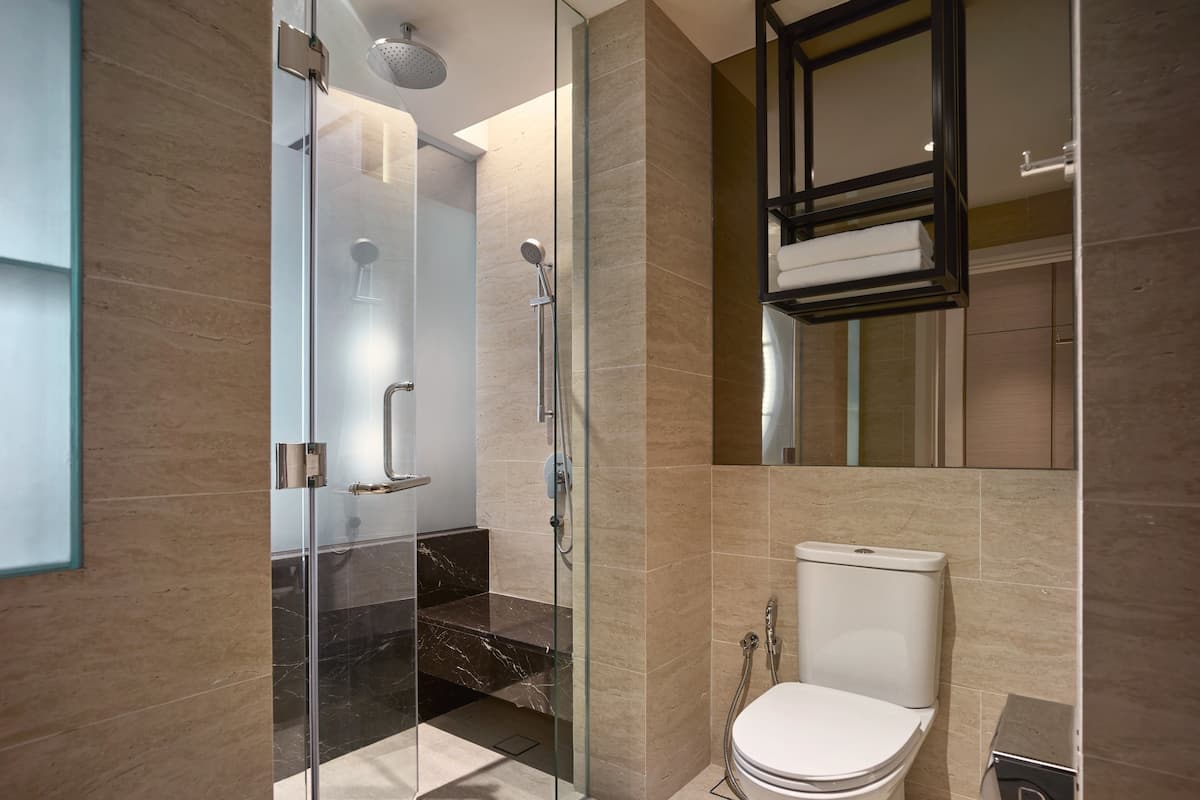 designer toiletries, hair dryer, bathrobes, slippers