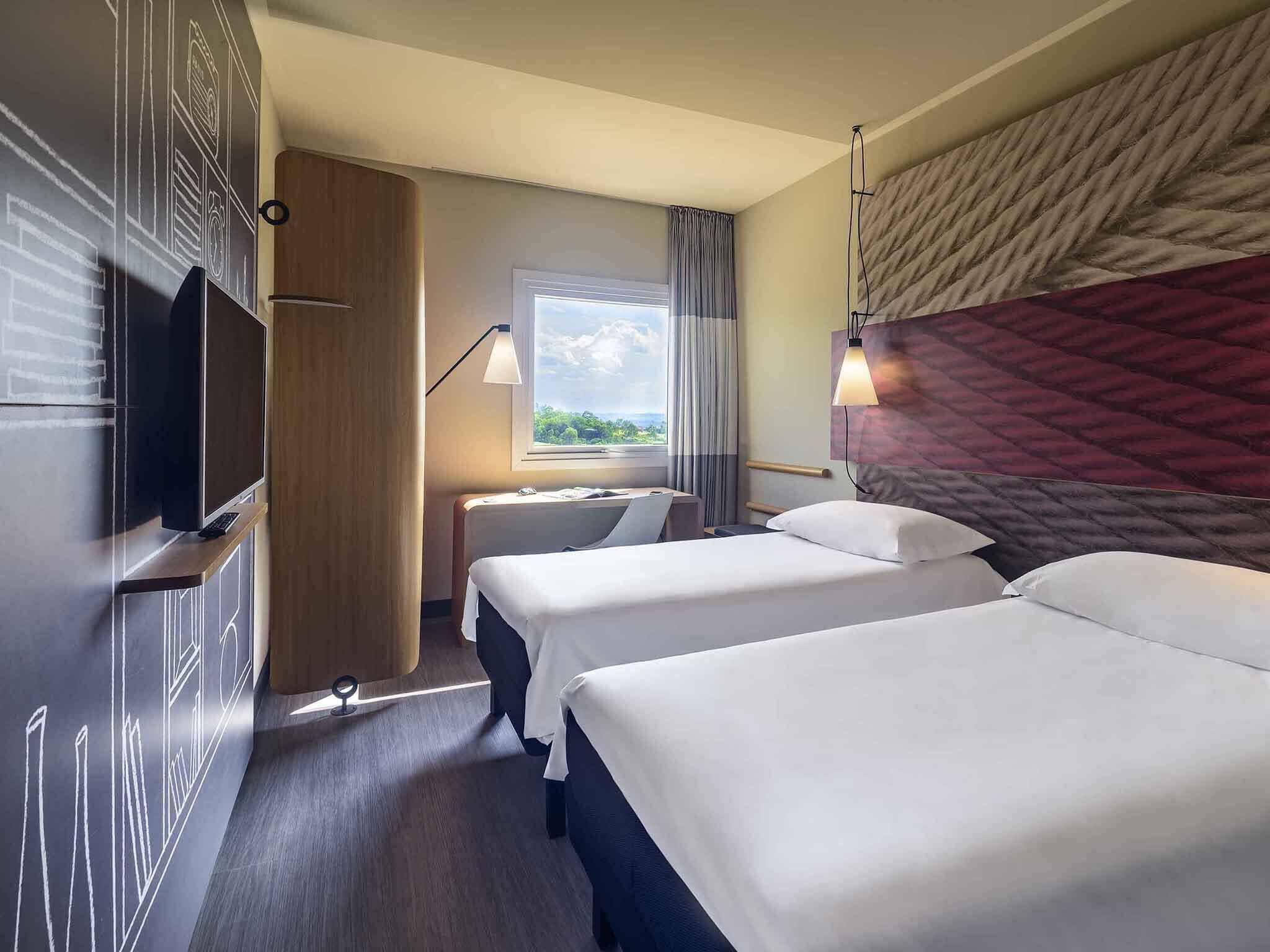 Departamento estándar, 2 camas individuales | Minibar, cortinas blackout, insonorización y wifi gratis 