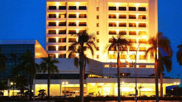 A multi-story hotel with a prominent sign reading "Dynasty Hotel." - Dynasty Hotel Miri (Miri)