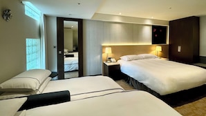 A hotel room with two beds, a nightstand with lamps, a wardrobe, and a bathroom visible through an open door. - K Hotels Taipei Tianjin (Taipei)