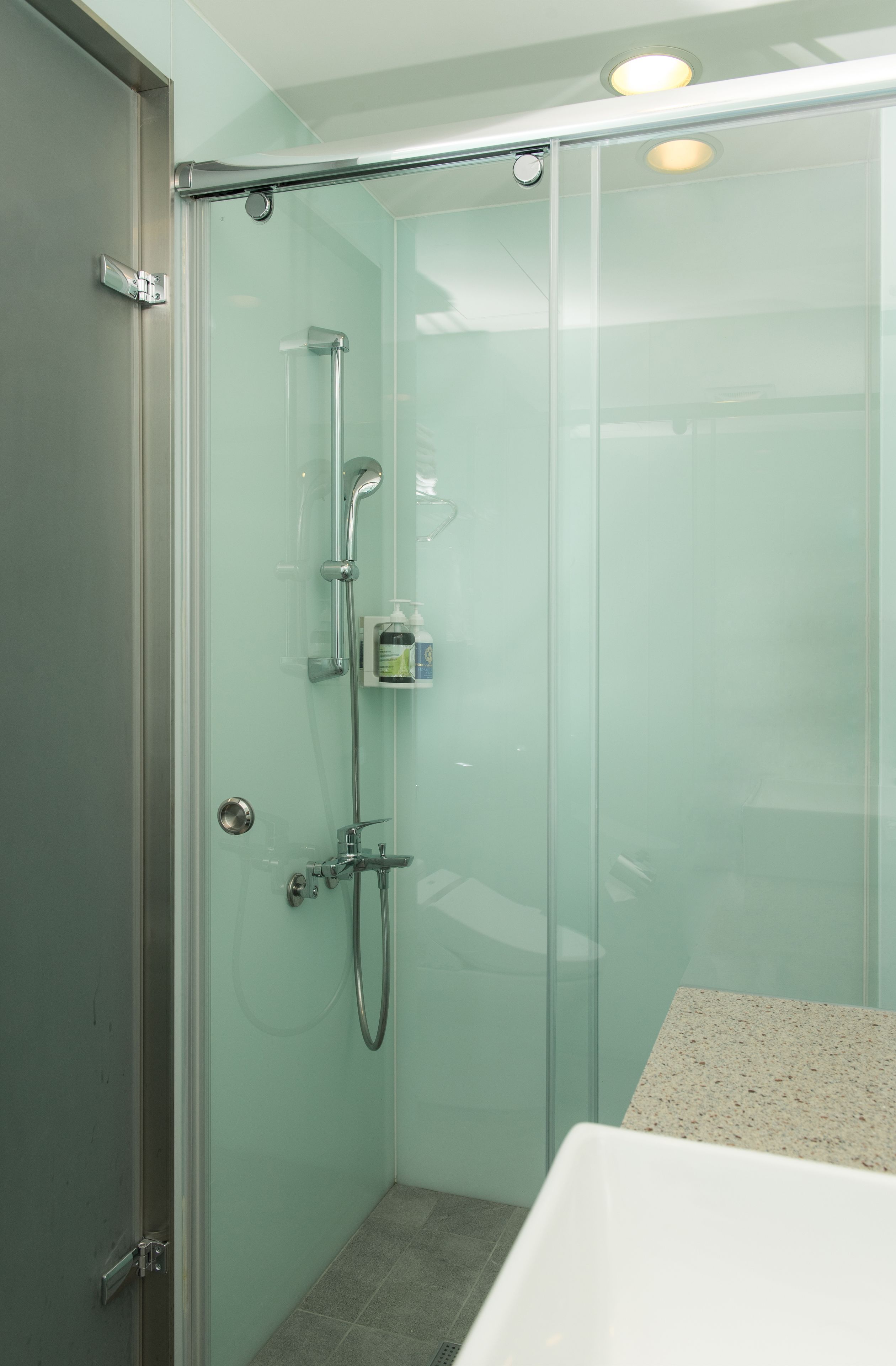 deluxe triple room | bathroom | shower, free toiletries, hair dryer, slippers